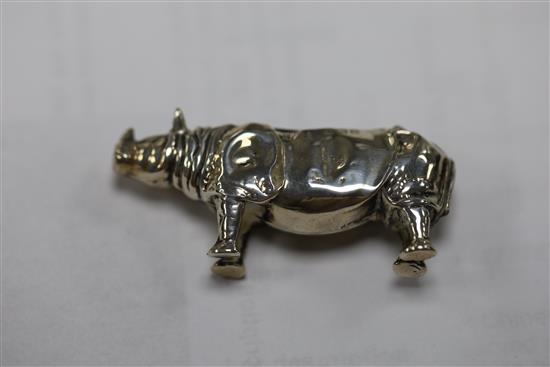 An Edwardian novelty silver pin cushion, modelled as a rhinoceros, Levi & Salaman, Birmingham, 1908, 46mm & two others.